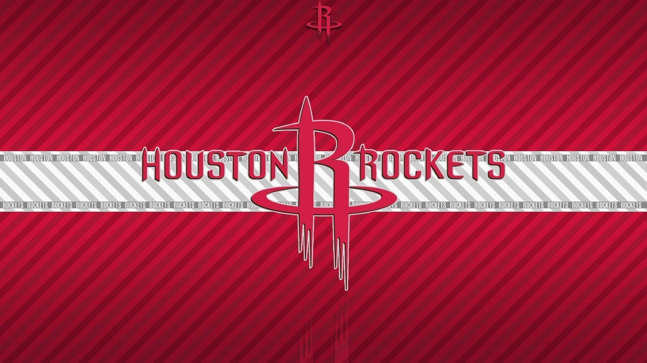 Houston Rockets 桌布 壁紙 — 休士頓火箭隊標誌居中於大膽的紅色斜紋背景上，並重複球隊名稱文字。