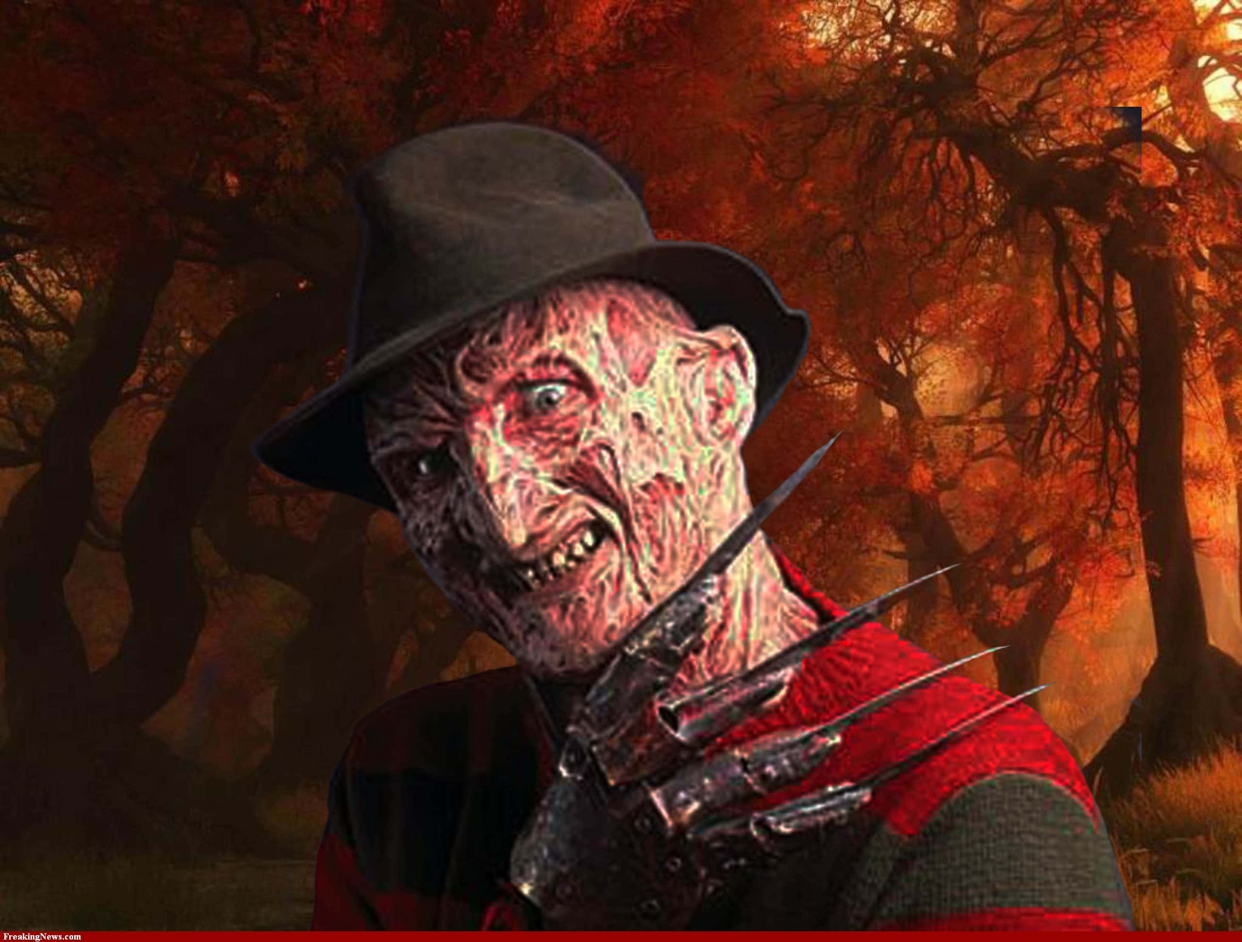 Freddy Krueger 桌布 壁紙 — 佛萊迪·克魯格戴著他標誌性的利刃手套，威嚇地站在火焰熊熊的秋日森林中。