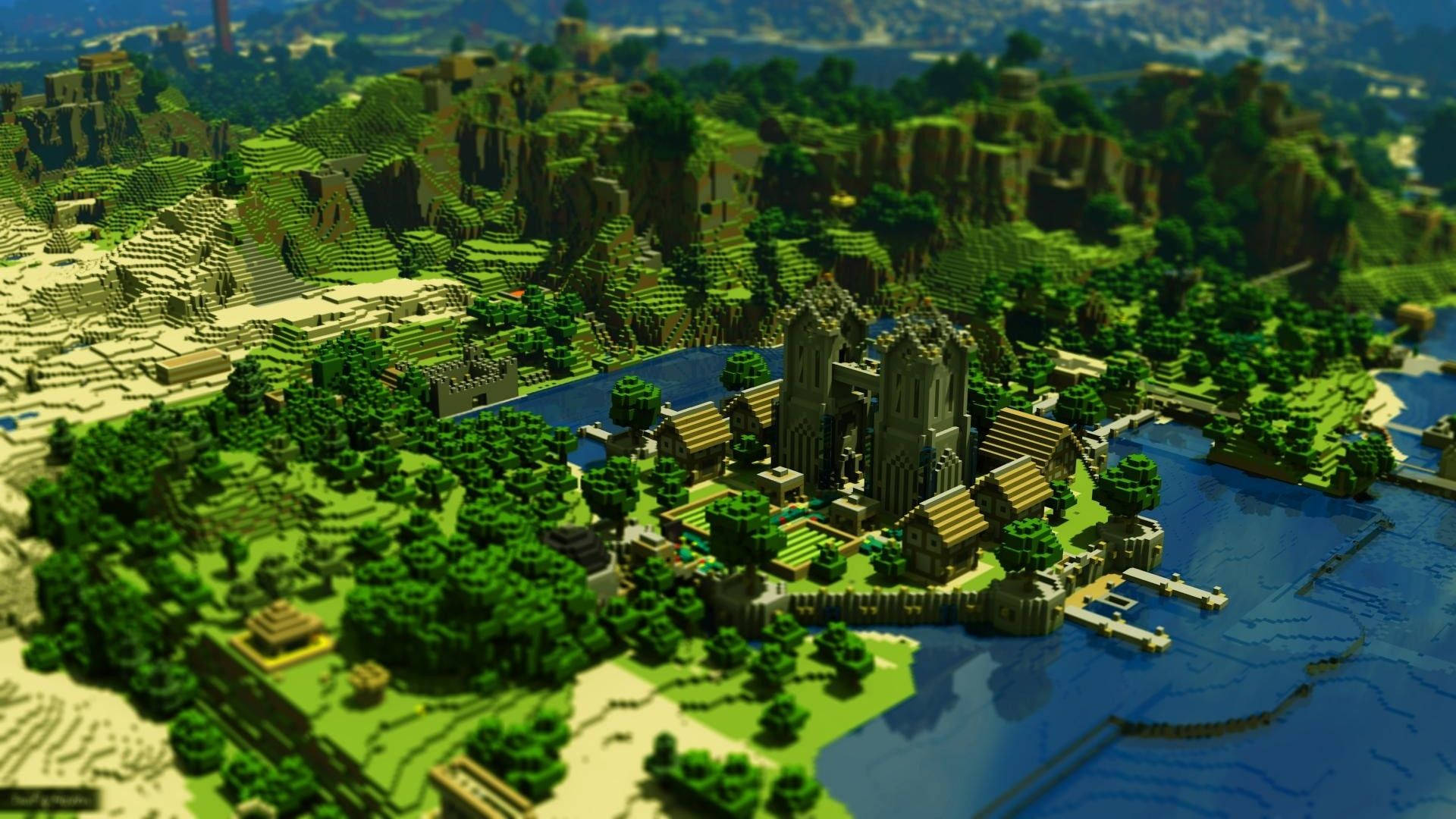 森林 桌布 壁紙 — 俯瞰一個細節豐富的Minecraft風格城堡小鎮，坐落於藍色河流旁，四周環繞著翠綠的山丘和懸崖。