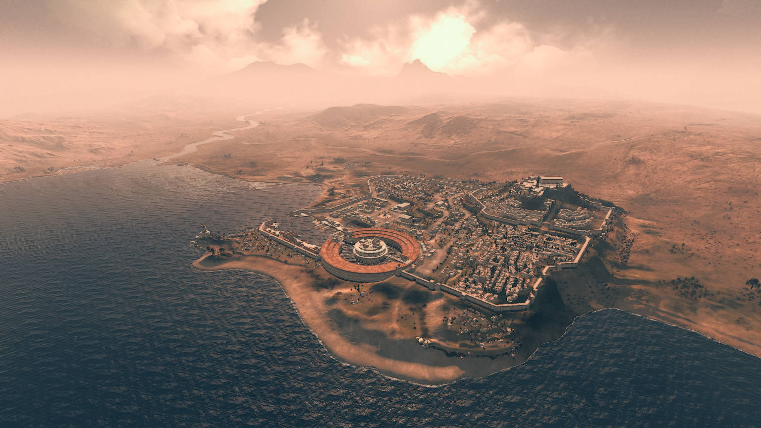 Carthage 桌布 壁紙 — 俯瞰古老沿海城市，圓形圓形劇場坐落於海與乾旱山丘之間，籠罩在朦朧的日落天空下。