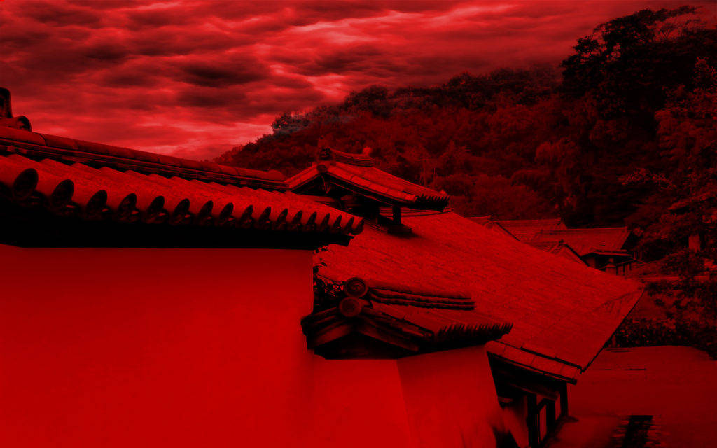 Red And Black Phone 桌布 壁紙 — 傳統瓦頂和牆壁在暴風雨般的深紅天空下沐浴在強烈的紅色中。