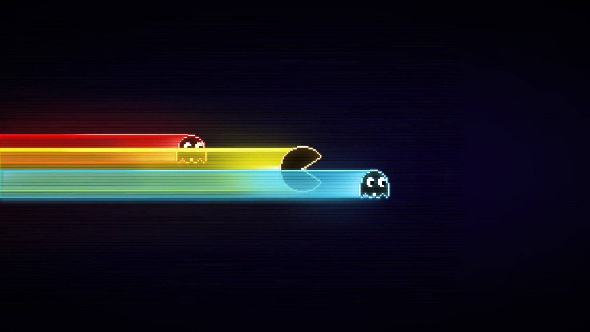 彩色動圖 桌布 壁紙 — 像素化的 Pacman 和鬼魂在黑暗的數位背景下沿著鮮豔的彩虹軌跡滑行。