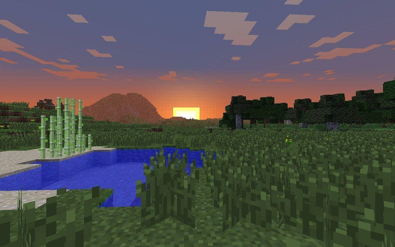 夕陽天空 桌布 壁紙 — 像素化的Minecraft日落場景，有河流、竹林和遠山，天空呈橙紫色。