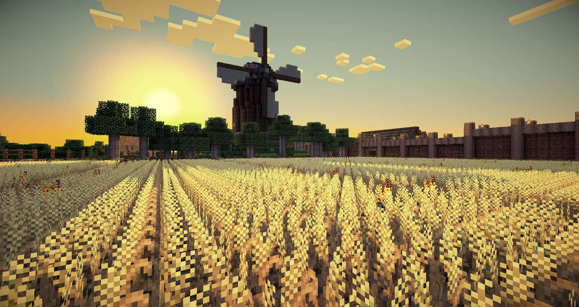 Rice 桌布 壁紙 — 像素化的Minecraft金色麥田延伸至夕陽下的風車，伴隨著方塊狀的樹木和天空。