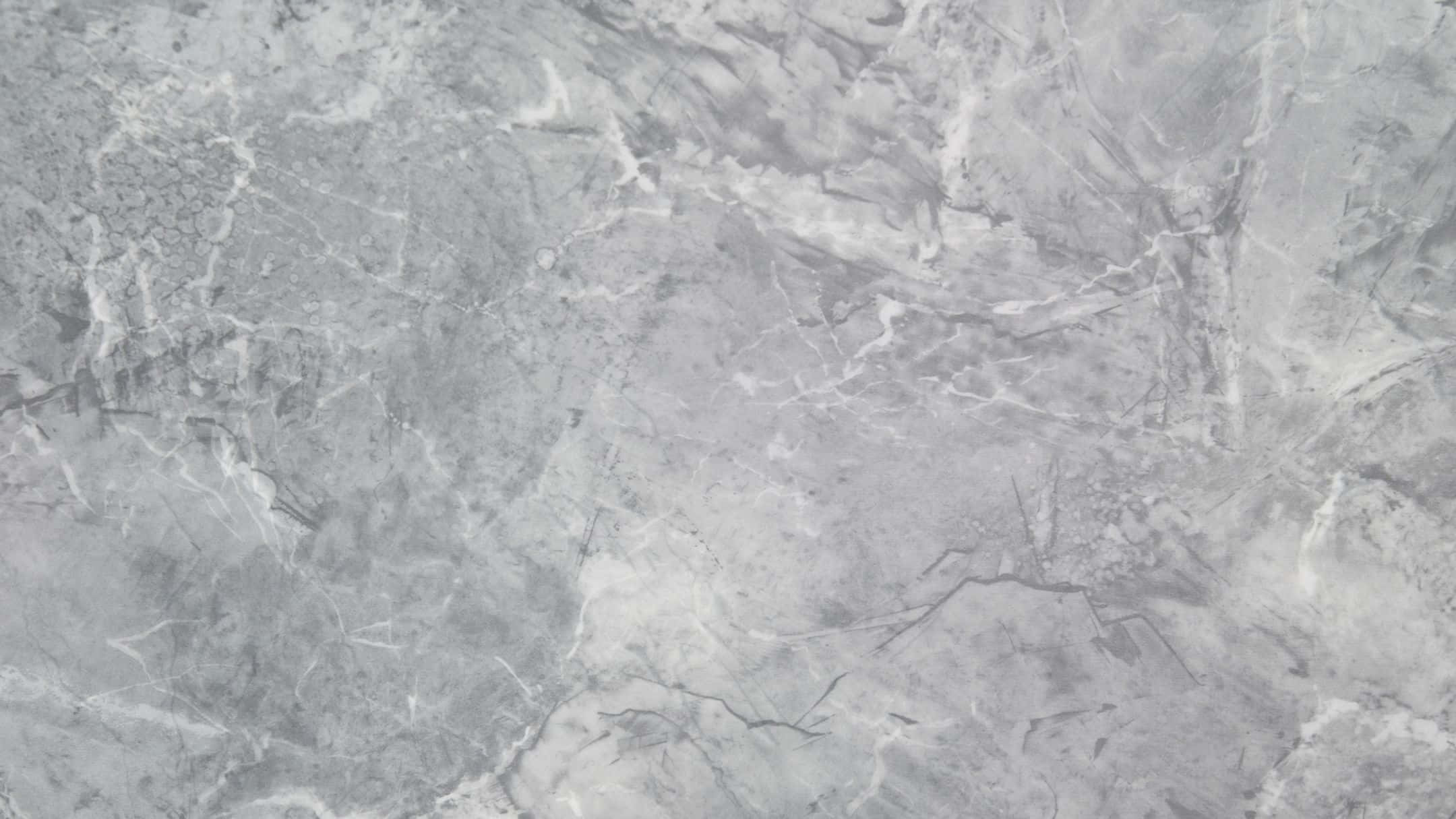 Grey Marble 桌布 壁紙 — 優雅灰色大理石的近距離特寫，帶有漩渦狀白色和深色紋理，營造出奢華的天然石材質感。