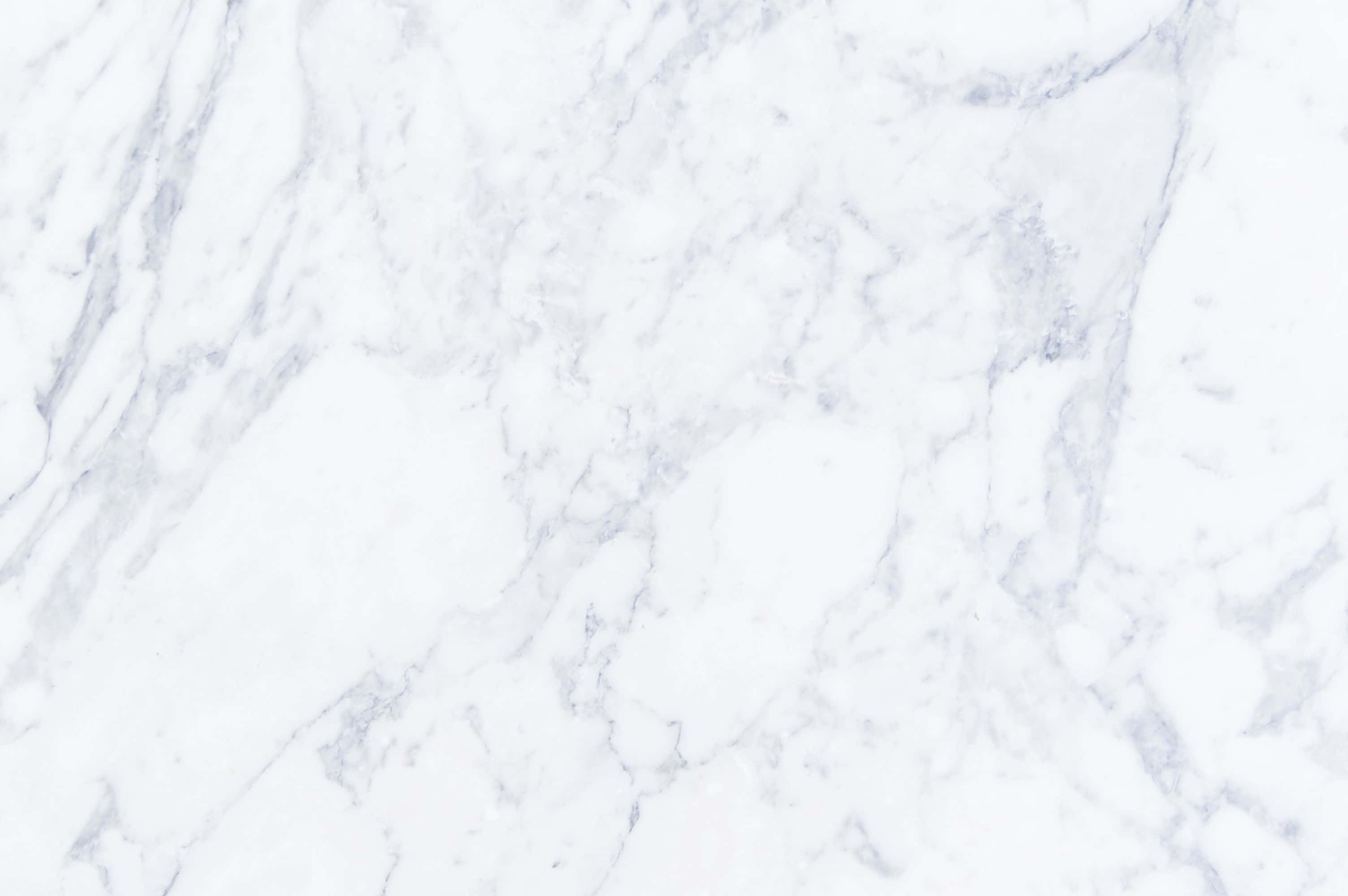Marble Macbook 桌布 壁紙 — 優雅白色大理石的特寫，帶有柔和灰色紋理，營造出奢華天然石材質感。