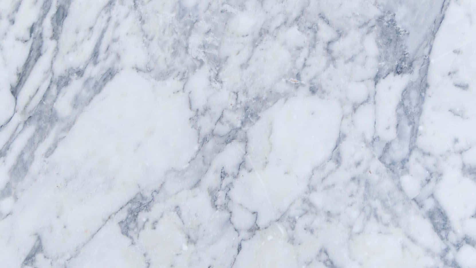Marble Macbook 桌布 壁紙 — 優雅白色大理石的特寫，帶有複雜的灰色紋理，展現天然石材質感。
