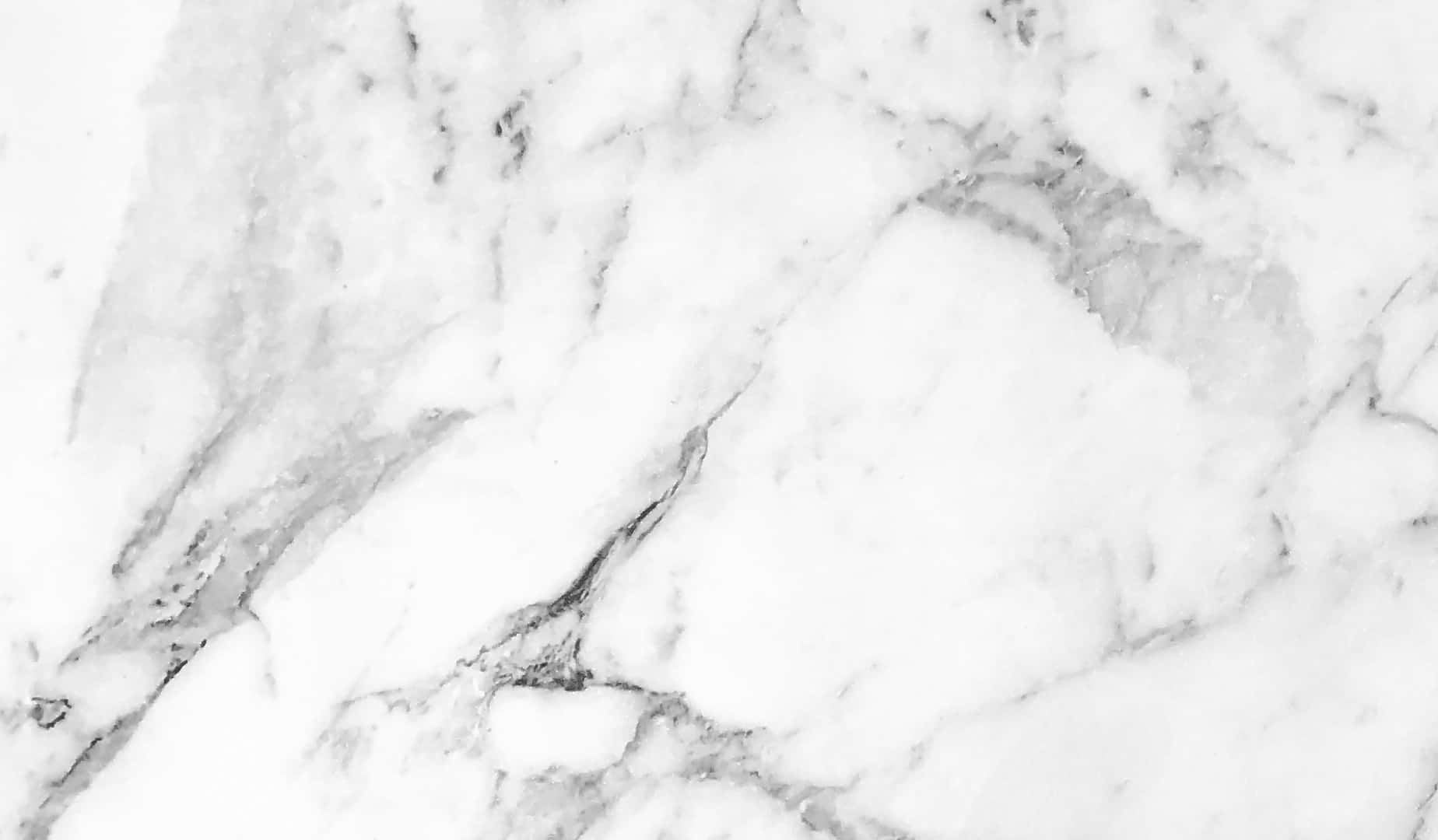 Aesthetic Marble 桌布 壁紙 — 優雅白色大理石的近距離特寫，帶有旋轉的灰色紋理，營造出奢華的自然石材質感。