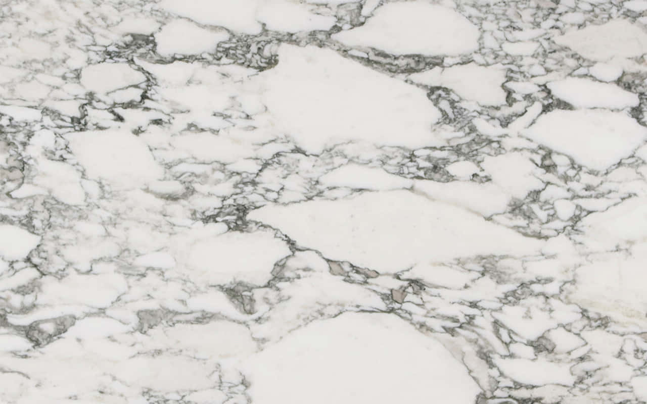 Marble Macbook 桌布 壁紙 — 優雅白色大理石的近距離特寫，帶有複雜的灰色紋理圖案。