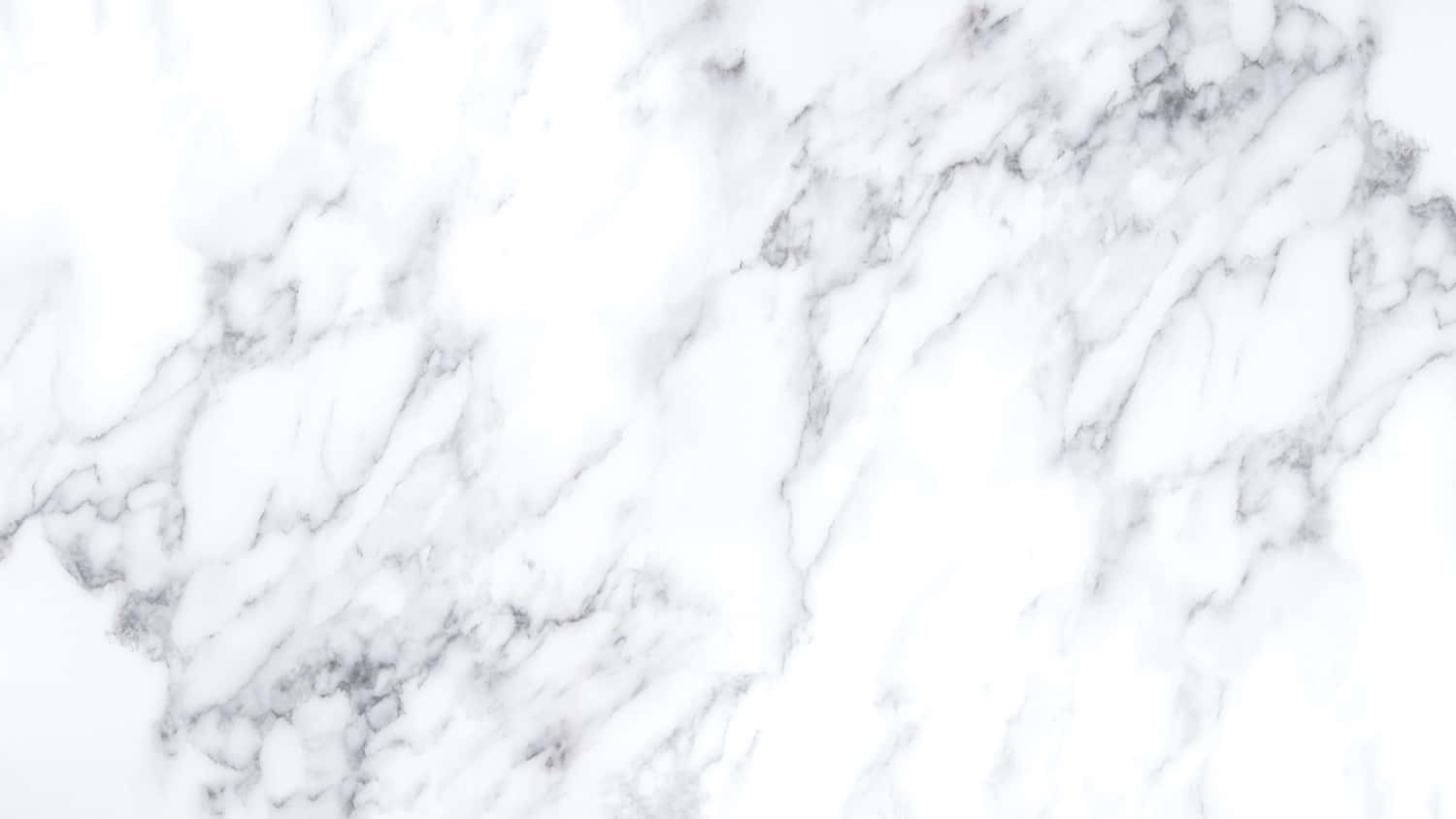 White Marble 桌布 壁紙 — 優雅白色大理石的近距離特寫，帶有柔和灰色紋理，營造出奢華天然石材質感。