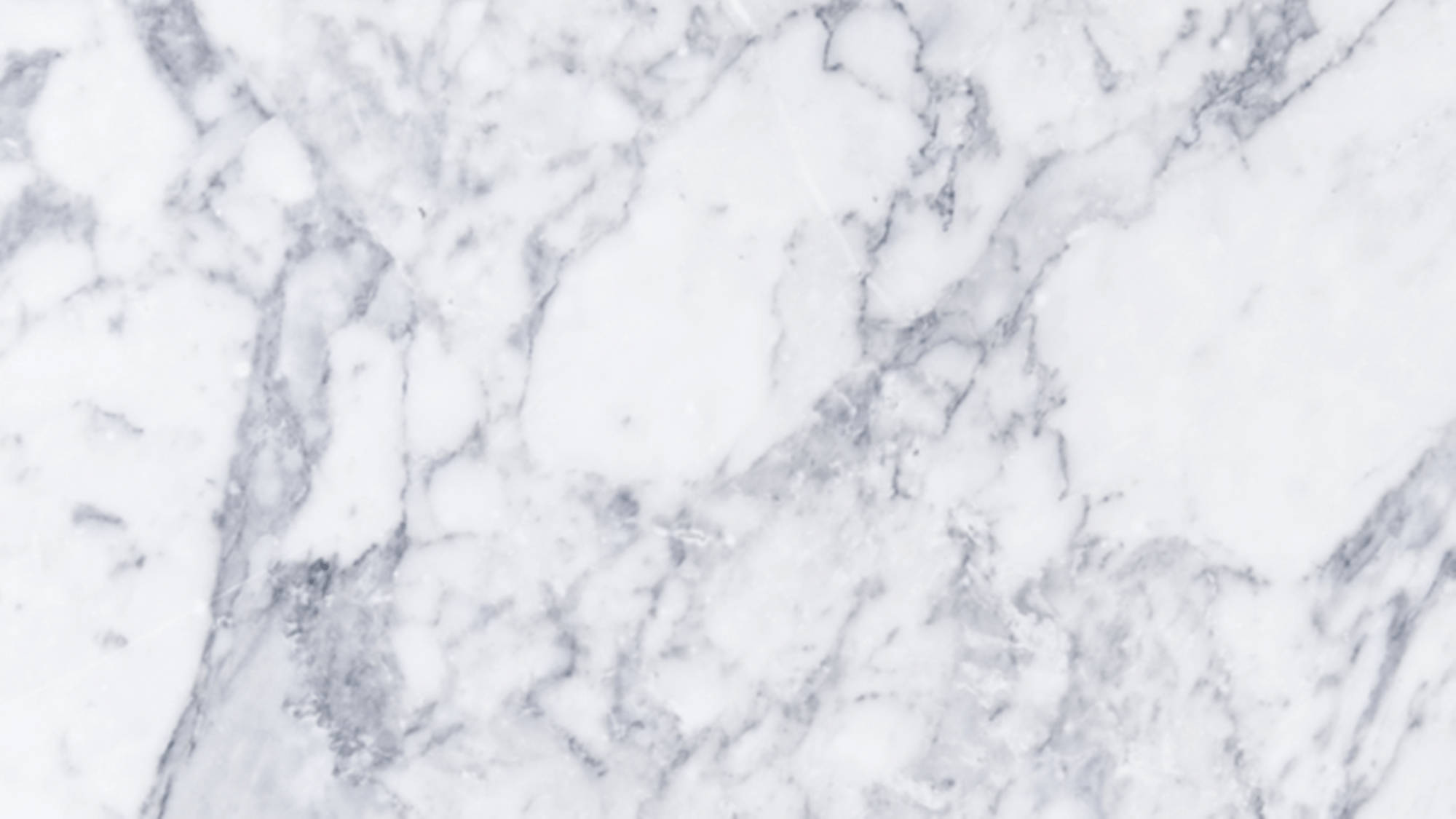 Aesthetic Marble 桌布 壁紙 — 優雅白色大理石的近距離特寫，帶有旋轉的灰色紋理，營造出奢華的天然石材圖案。