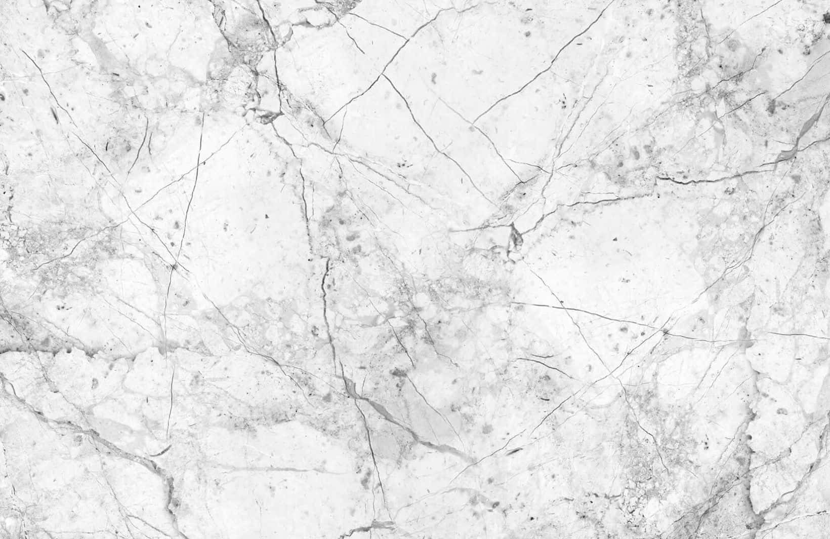 Granite 桌布 壁紙 — 優雅白色大理石的近距離特寫，帶有複雜的灰色紋理和微妙的自然瑕疵。