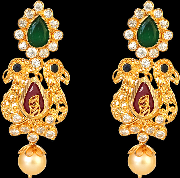 Indian Jewellery 桌布 壁紙 — 優雅的金色耳環，綴有祖母綠淚滴、紅寶石鳥和珍珠水滴，襯托黑色背景。