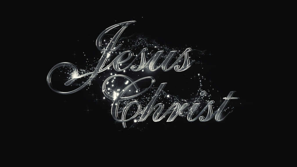 Jesus Name 桌布 壁紙 — 優雅的銀色草書文字 'Jesus Christ' 在黑色背景上閃爍，帶有閃爍的粒子。