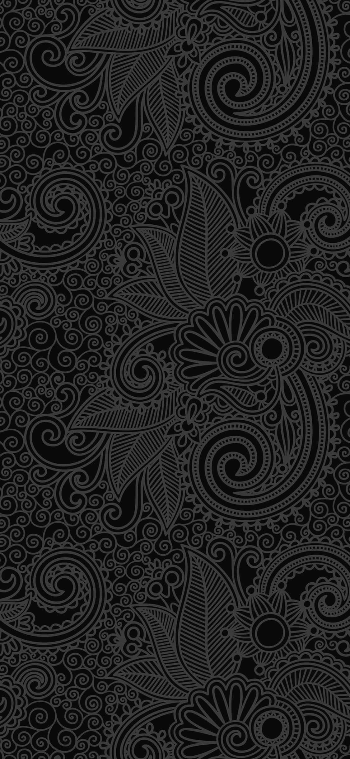Cool Design iPhone 桌布 壁紙 — 優雅的黑灰色花卉漩渦在深色背景上形成密集的裝飾圖案。