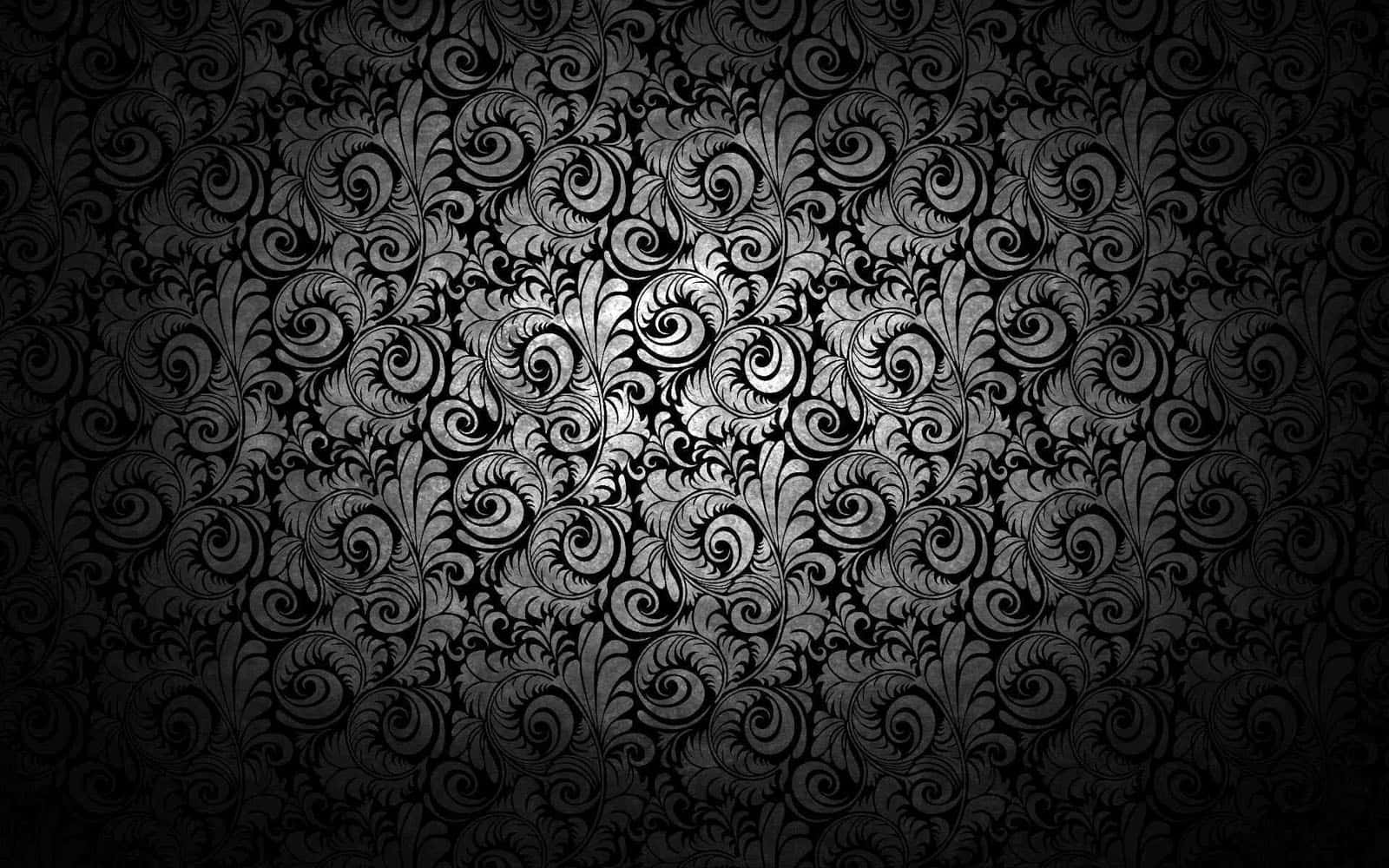 Dark Texture 桌布 壁紙 — 優雅的黑銀色大馬士革壁紙，帶有從明亮中心輻射出的漩渦花卉圖案。