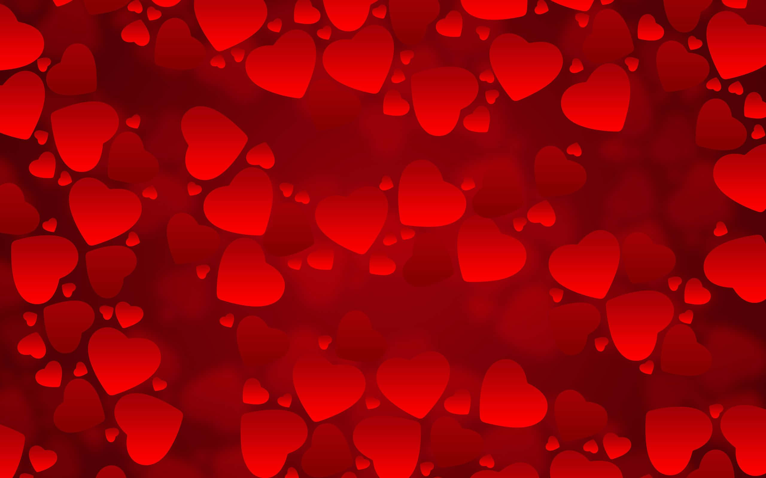Cute Hearts 桌布 壁紙 — 充滿不同大小柔和發光心形的鮮豔紅色背景，營造出浪漫夢幻的氛圍。