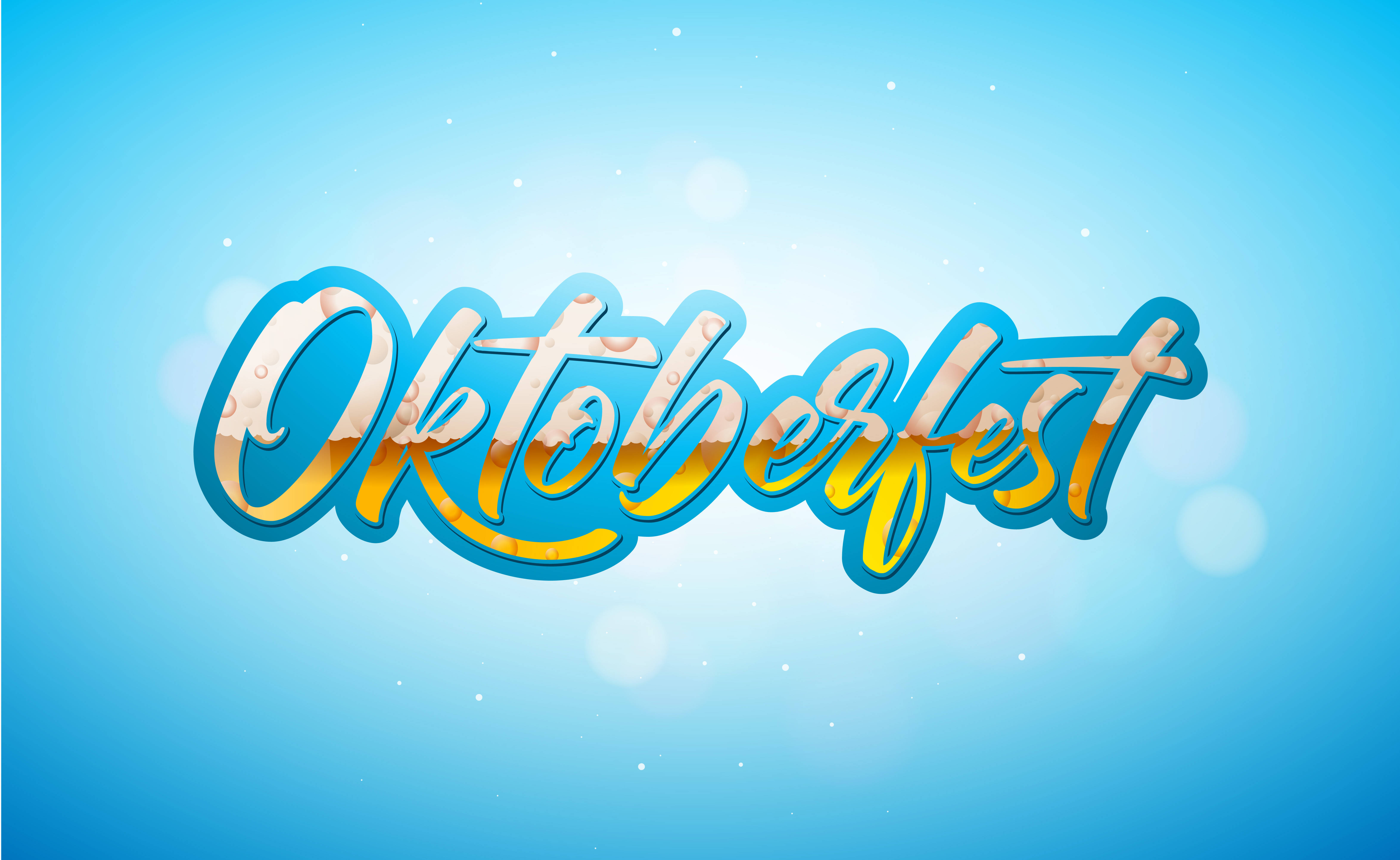 慕尼黑啤酒節 桌布 壁紙 — 充滿活力的 Oktoberfest 草書文字，帶有啤酒泡沫紋理，置於柔和的藍色漸變背景上，並有散景燈光。