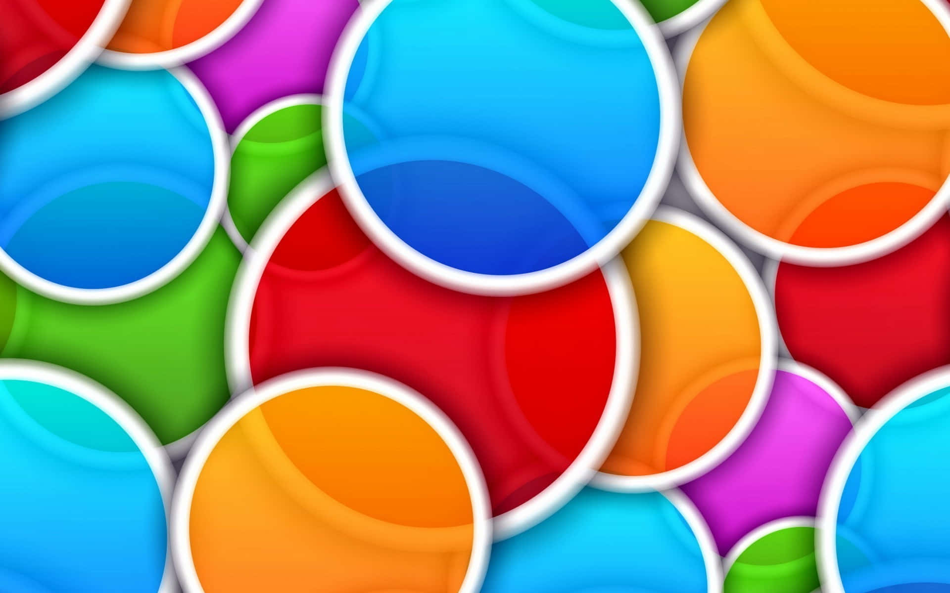 Abstract Colorful 桌布 壁紙 — 充滿活力的光澤圓圈以彩虹色調重疊，帶有白色邊框，營造出俏皮的數位圖案。