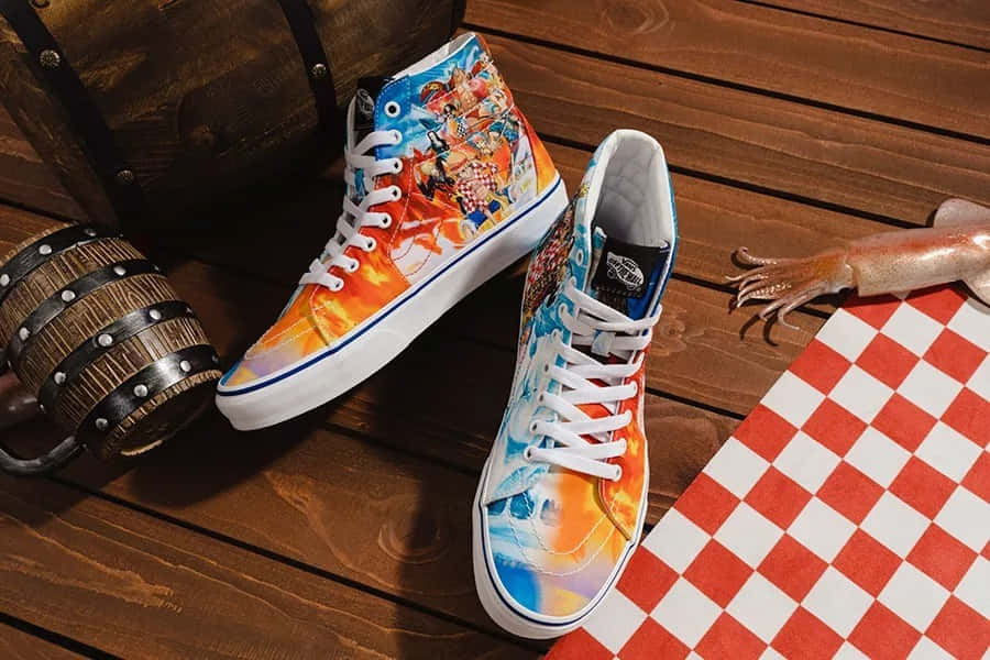 Vans 桌布 壁紙 — 充滿活力的動漫主題高筒運動鞋，帶有火焰漸變設計，放在木甲板上，旁邊有魷魚和格子布。