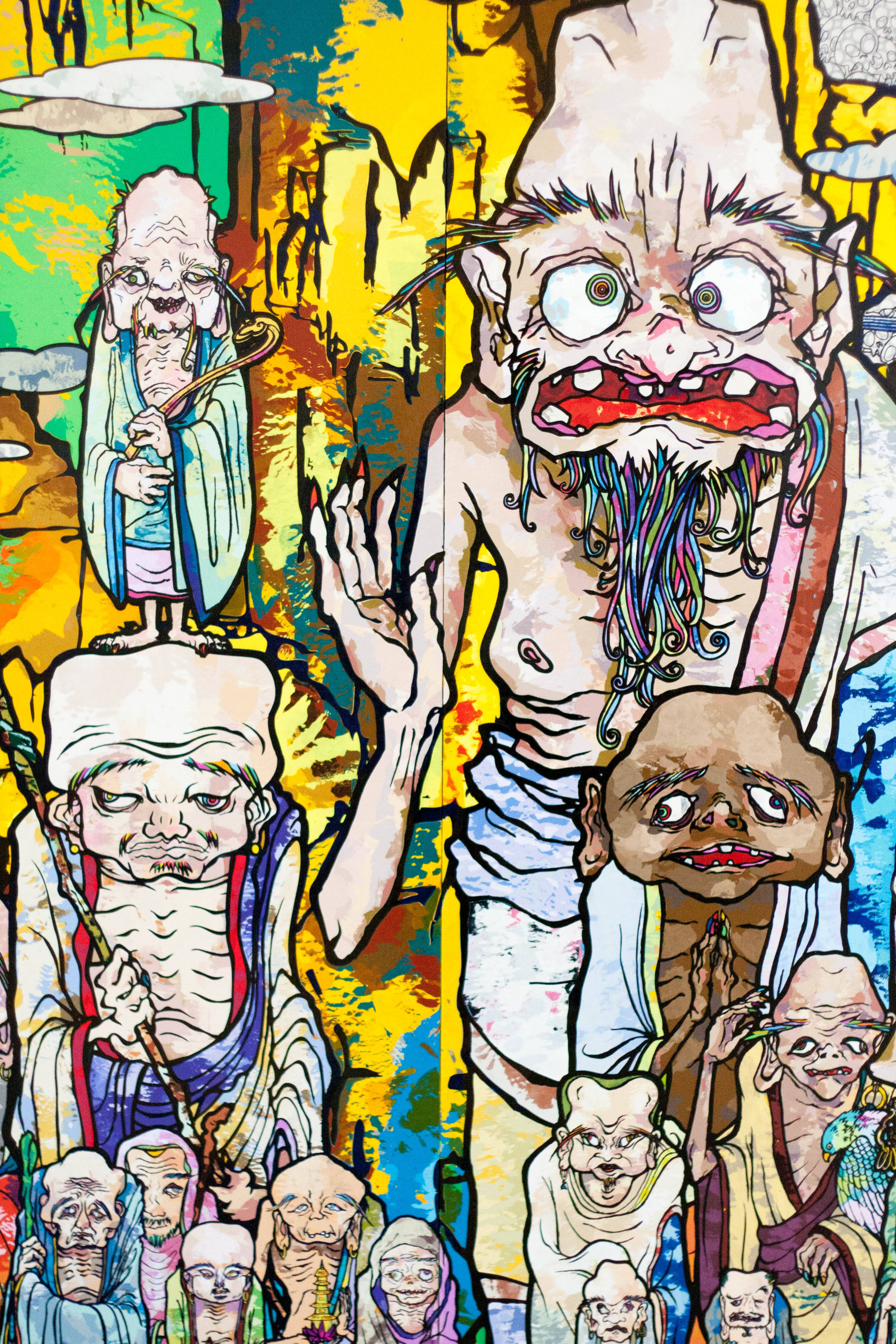藝術 桌布 壁紙 — 充滿活力的卡通風格插圖，描繪怪誕、誇張的僧侶，表情狂野，背景色彩繽紛且混亂。