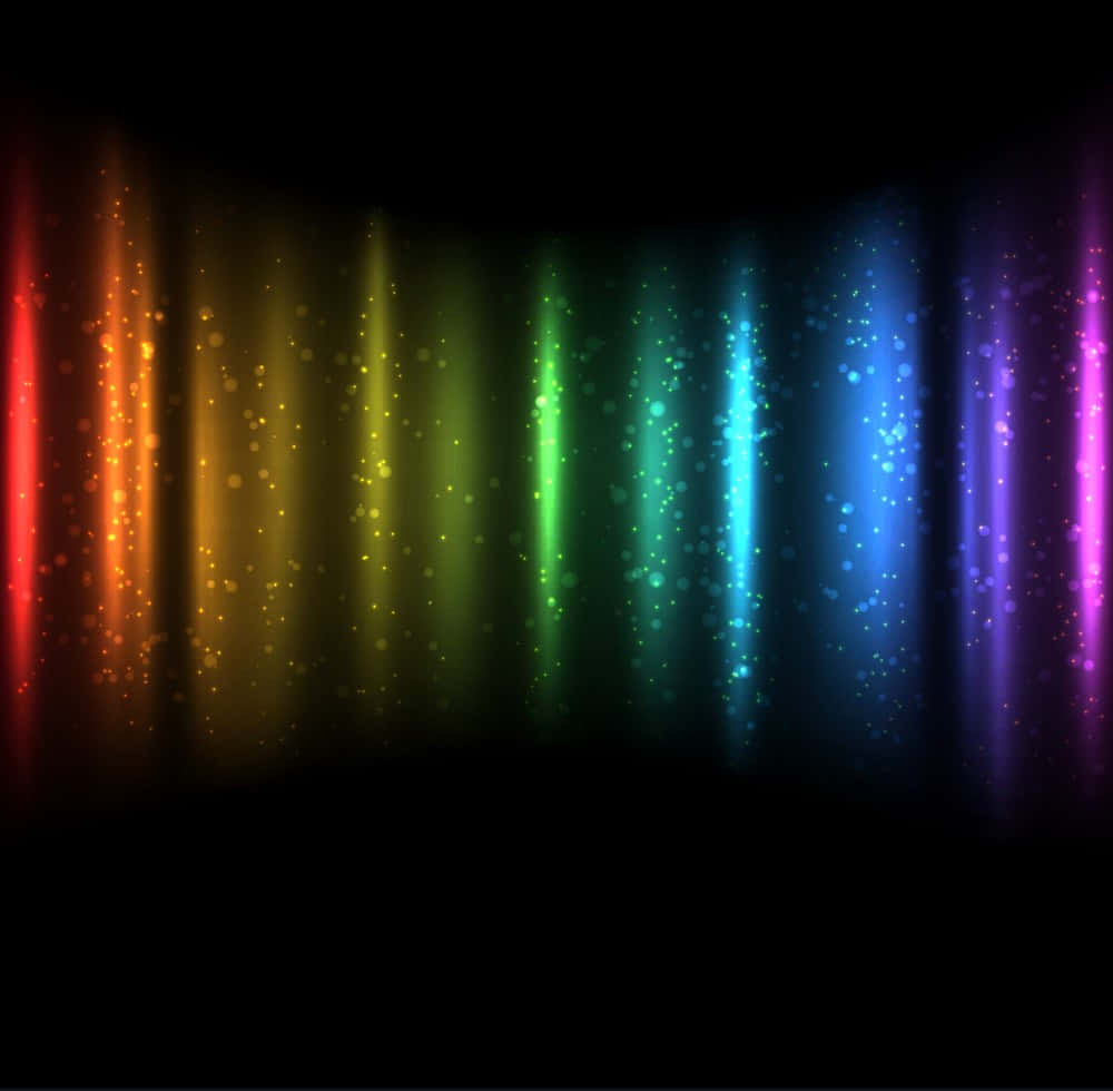 Spectrum 桌布 壁紙 — 充滿活力的垂直彩虹光束，帶有發光粒子，在黑暗背景下層疊而下。