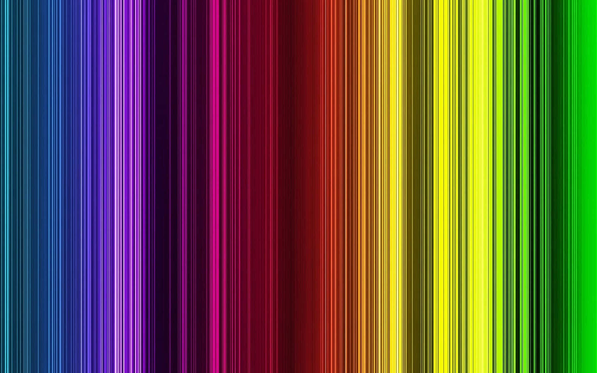 Spectrum 桌布 壁紙 — 充滿活力的垂直條紋從藍色平穩過渡到綠色，經過洋紅色、紅色和黃色，形成彩虹漸變。