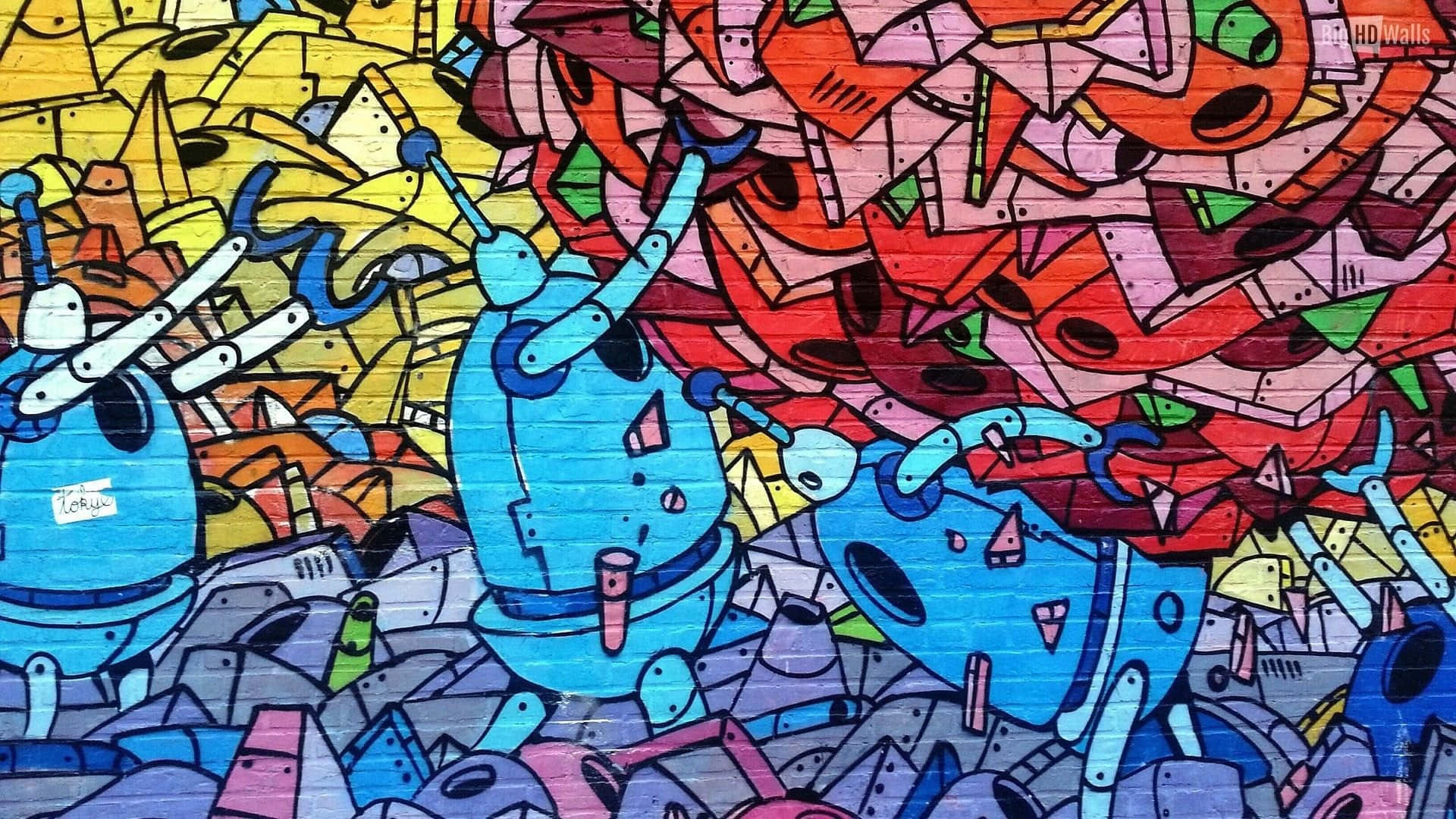 Graffiti Desktop 桌布 壁紙 — 充滿活力的塗鴉藝術描繪了三個藍色機器人形象，置身於色彩繽紛的幾何形狀和抽象形態的混亂爆發之中。