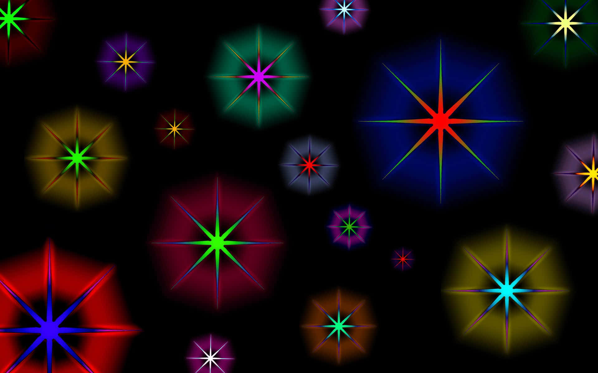 Stars 桌布 壁紙 — 充滿活力的多色星爆在深黑色背景上發光，形成動態的數位圖案。