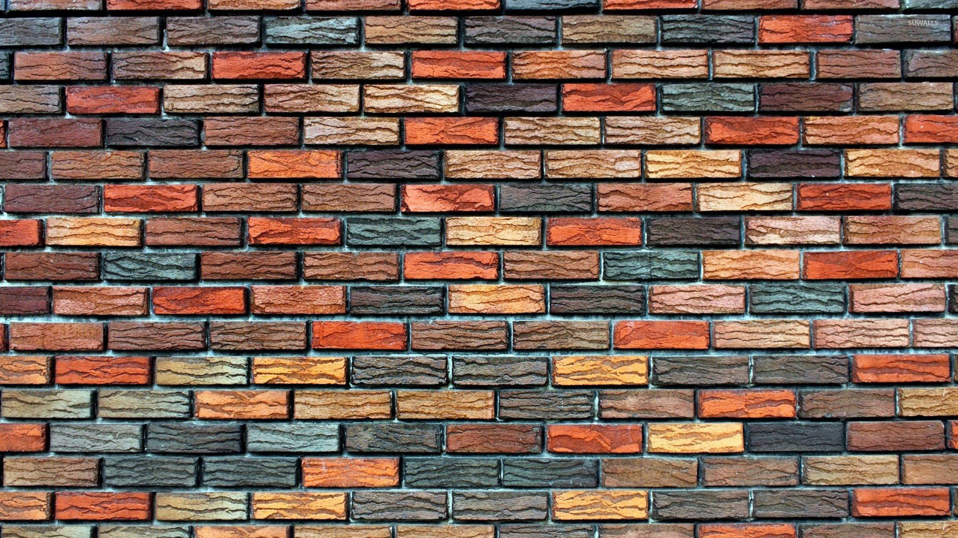 Brick 桌布 壁紙 — 充滿活力的多色磚牆特寫，帶有紋理灰泥線條和各種大地色調。
