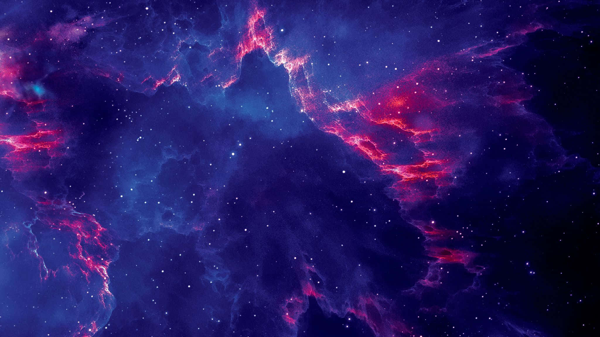 桌布 壁紙 — 充滿活力的宇宙星雲，帶有電光粉紅和深藍色的雲朵，在無數閃爍的星星中旋轉。