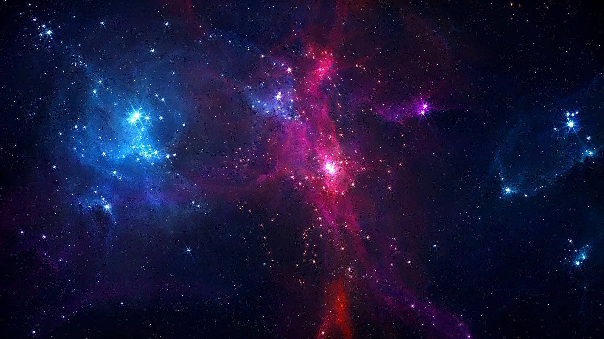 美學 桌布 壁紙 — 充滿活力的宇宙星雲，有旋轉的粉紅色、紫色和藍色雲朵，被明亮的星星照亮，背景是黑暗的虛空。