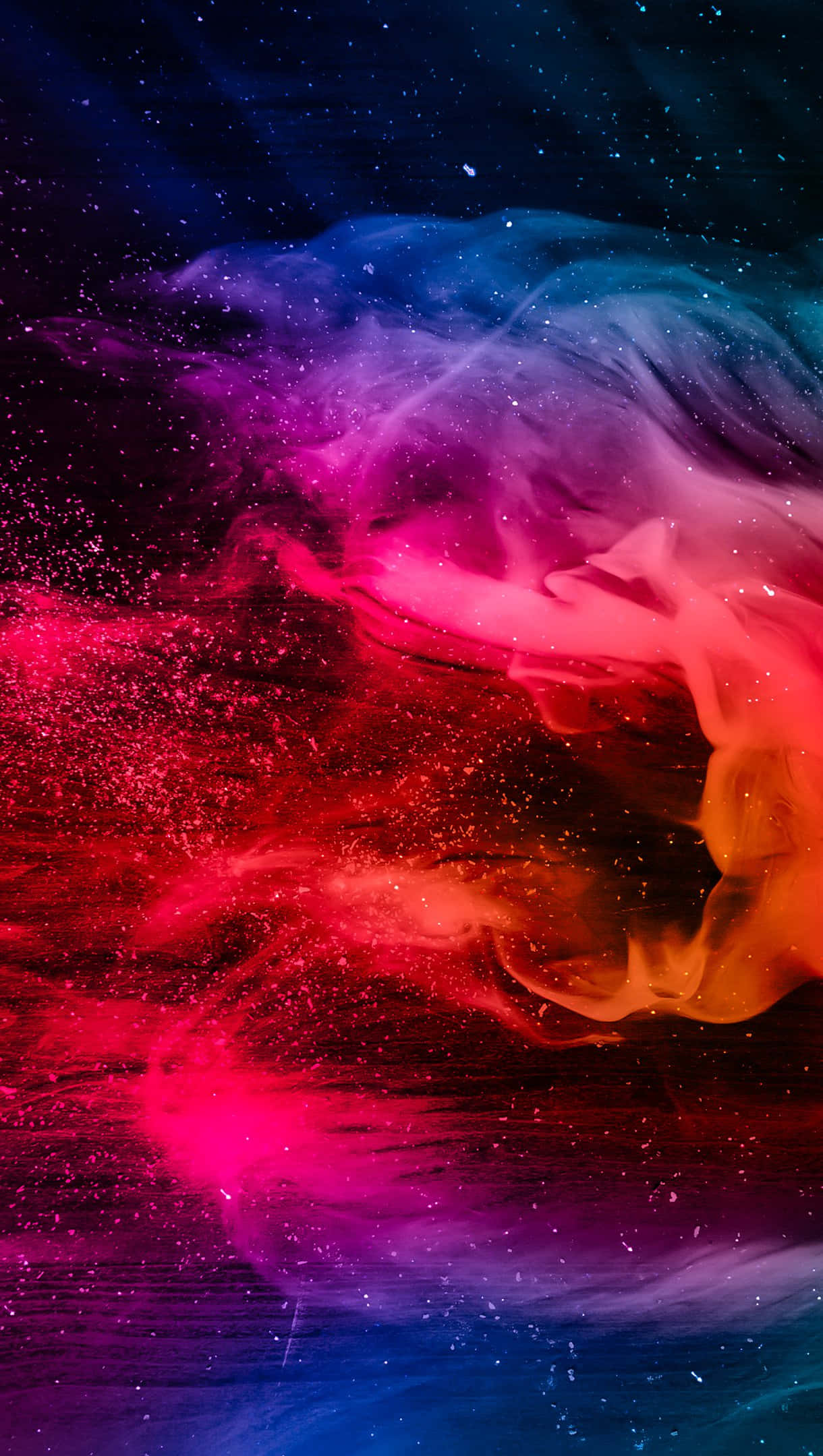 Colorful Smoke 桌布 壁紙 — 充滿活力的宇宙星雲在星場背景下以電光粉紅、橙色和深藍色旋轉。