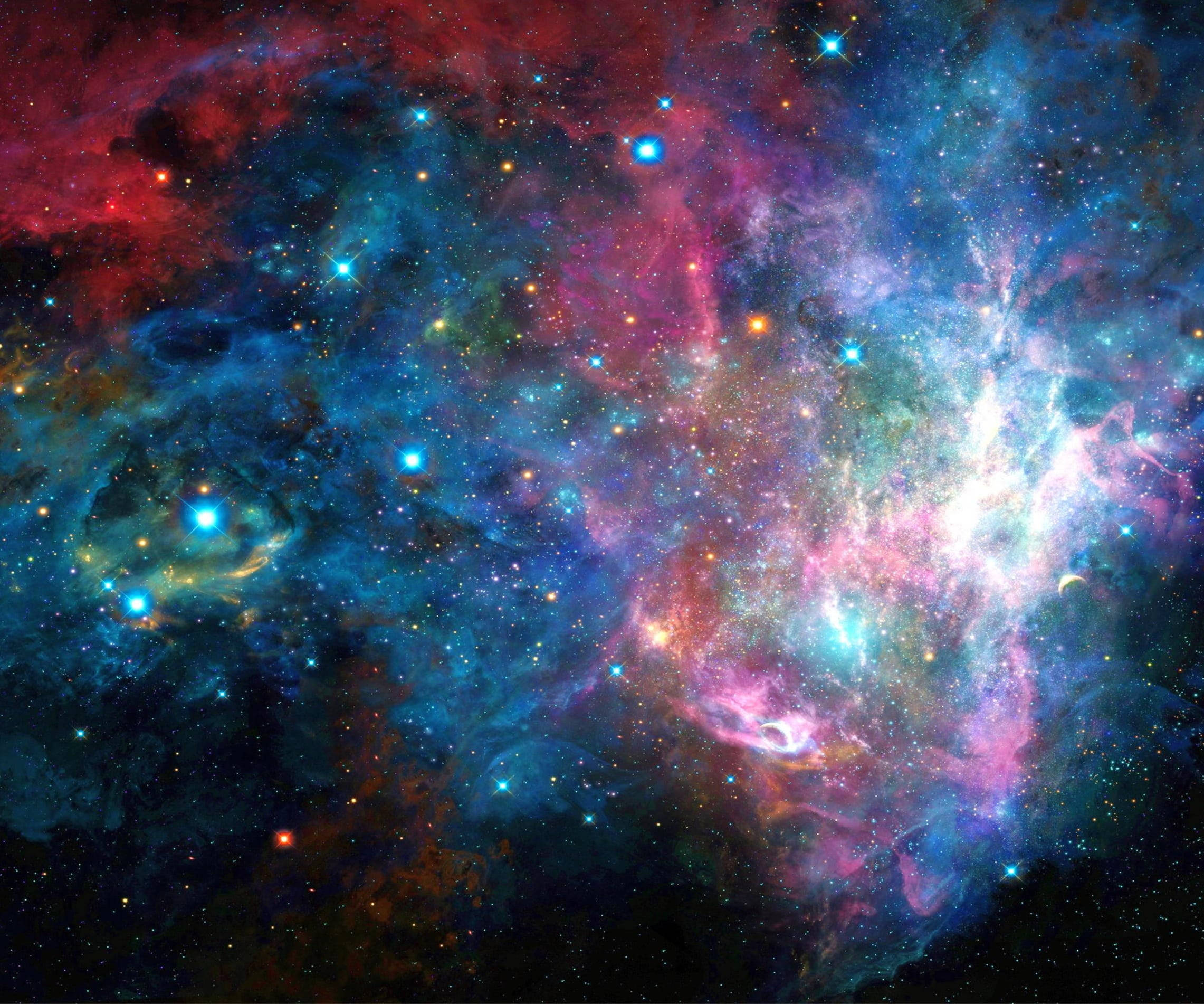 銀河 桌布 壁紙 — 充滿活力的宇宙星雲在深空背景下，以電光藍、粉紅和紅色漩渦，點綴著閃爍的星星。