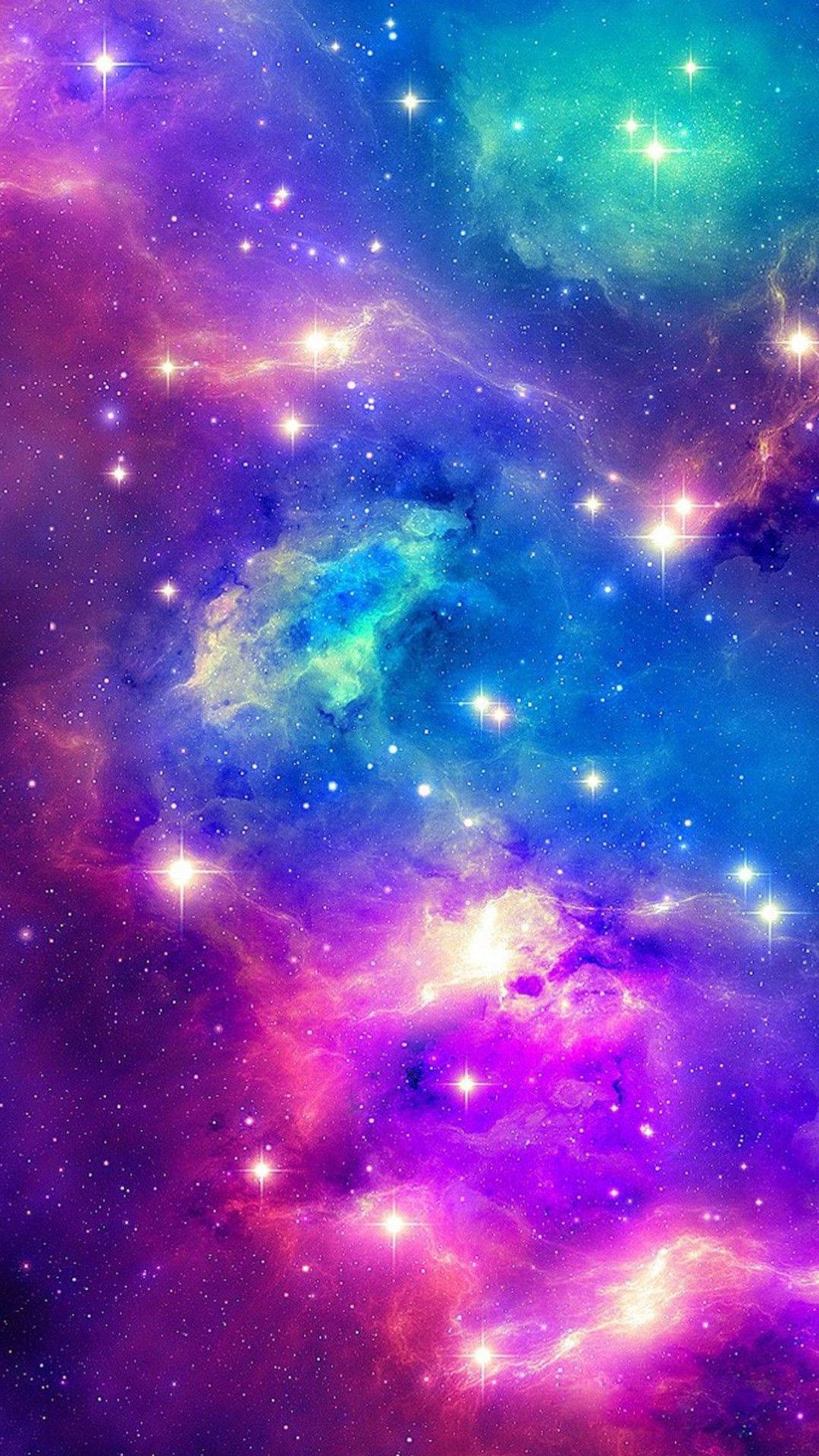 銀河 桌布 壁紙 — 充滿活力的宇宙星雲在紫色、藍色和藍綠色中旋轉，發光的星星散落在深邃太空的畫布上。