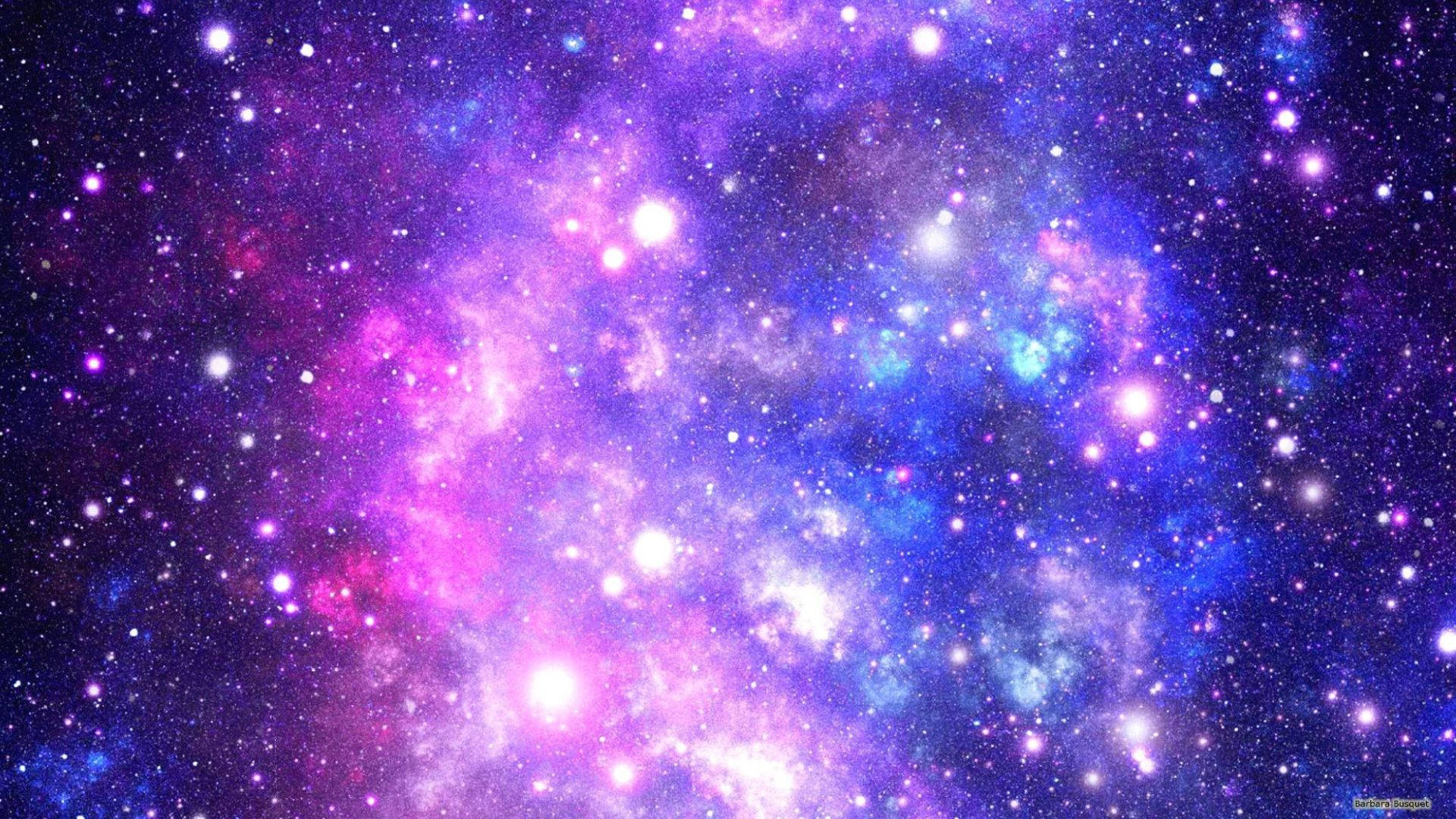 深空中帶有發光星星的充滿活力的紫色、藍色和粉紅色星雲。 — 可愛的銀河動圖 壁紙