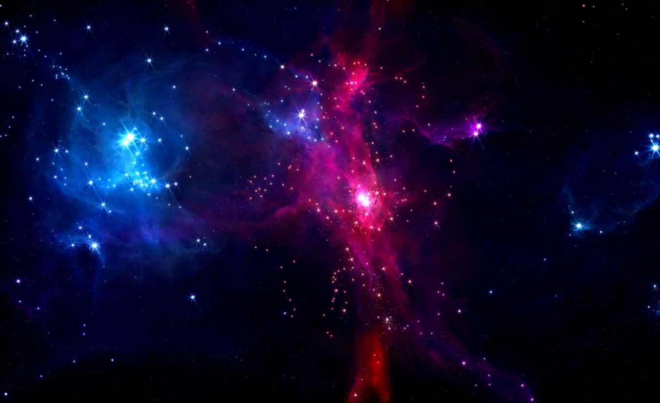 Colorful Galaxy 桌布 壁紙 — 充滿活力的宇宙星雲在繁星點點的黑色虛空中發出電光藍和粉紅色的光芒。