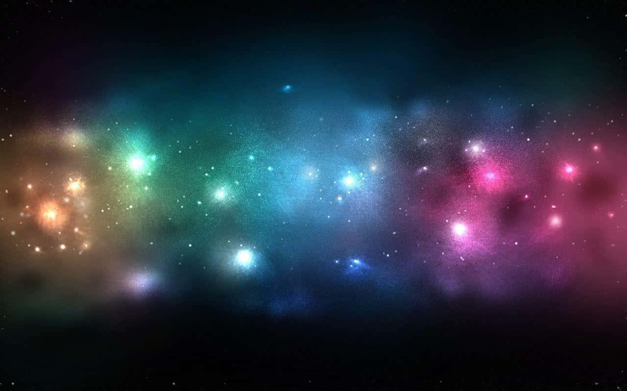 銀河 桌布 壁紙 — 充滿活力的宇宙星雲在繁星點點的黑色虛空中散發出藍綠色、粉紅色和金色的光芒。