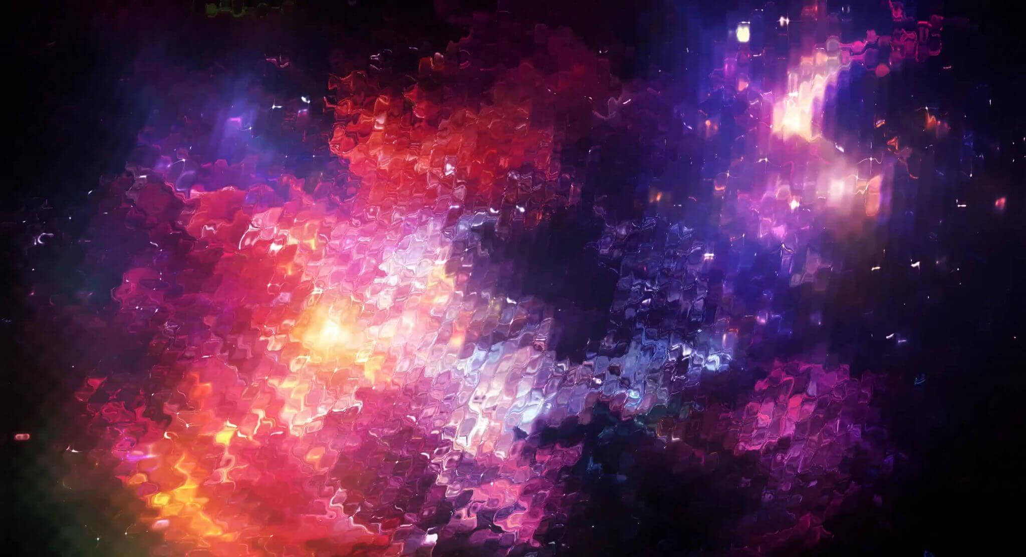 Spectrum 桌布 壁紙 — 充滿活力的宇宙星雲在黑暗的星空虛空中以火紅、紫色和藍色旋轉。