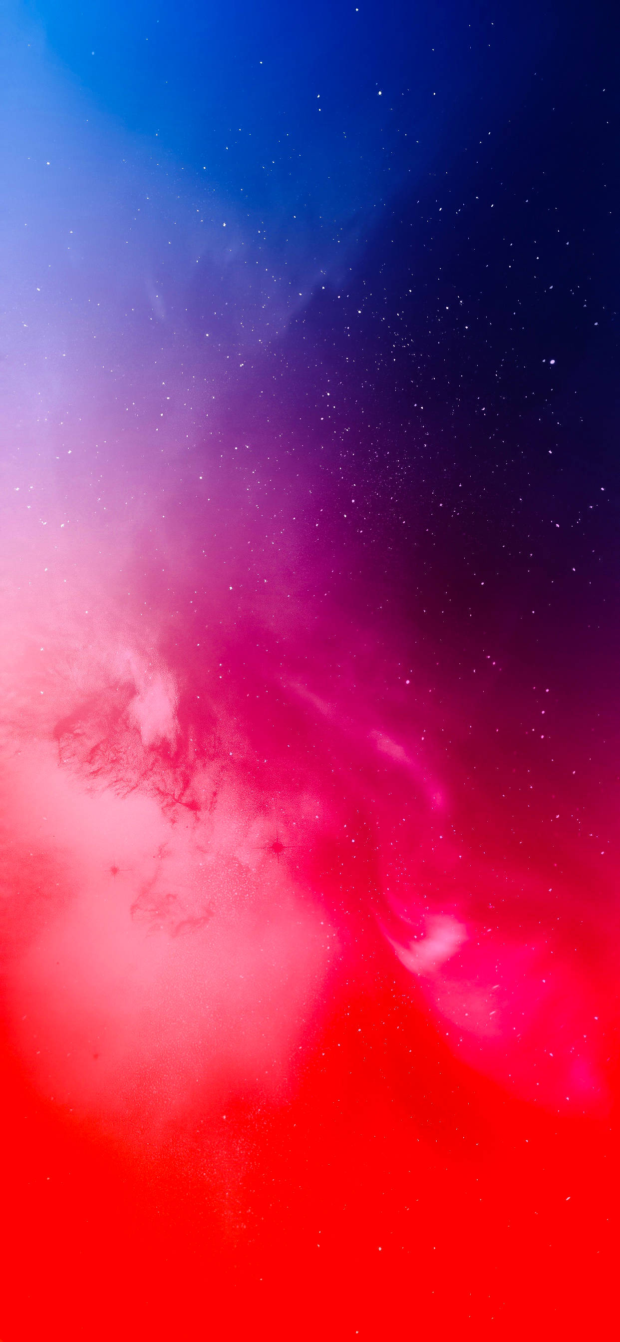 iPhone 桌布 壁紙 — 充滿活力的宇宙星雲在黑暗虛空中以電光紅和深藍色旋轉，點綴著散落的星星。