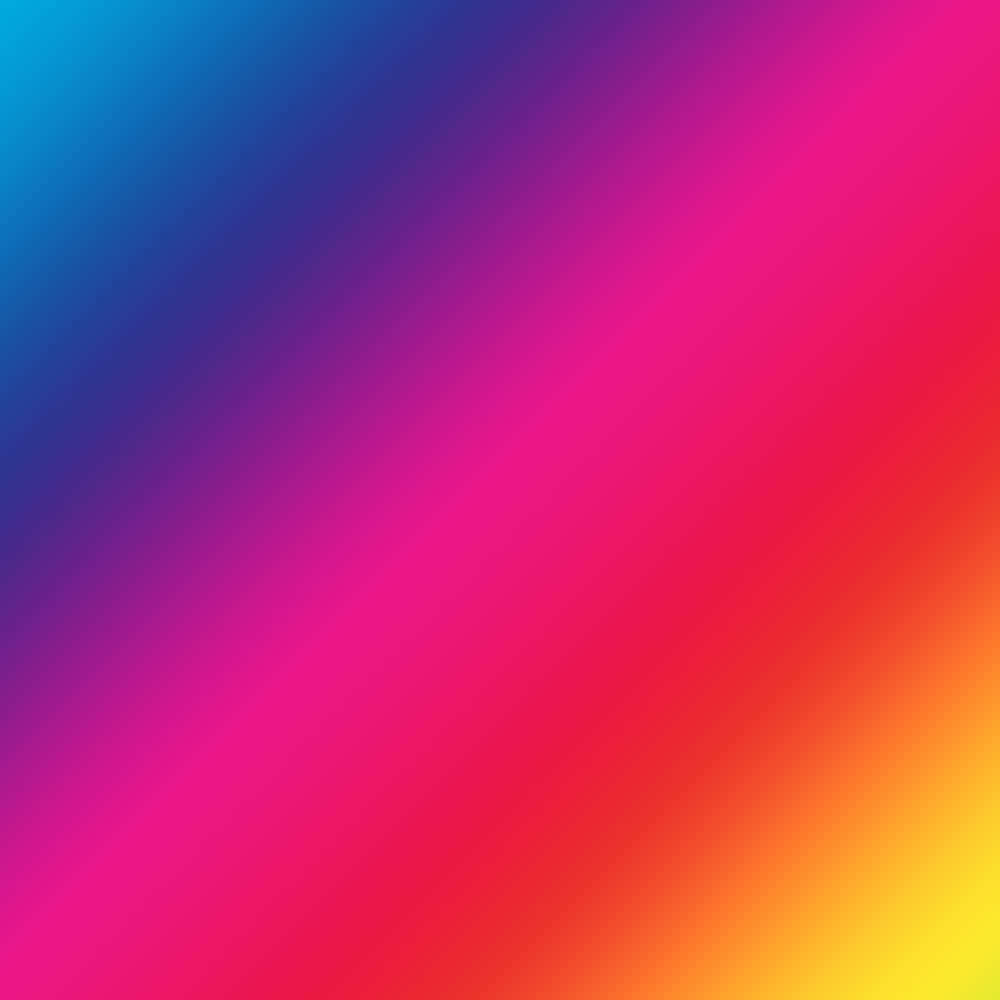 Rainbow Gradient 桌布 壁紙 — 充滿活力的對角漸變從冷藍色通過洋紅色和紅色過渡到暖黃色。