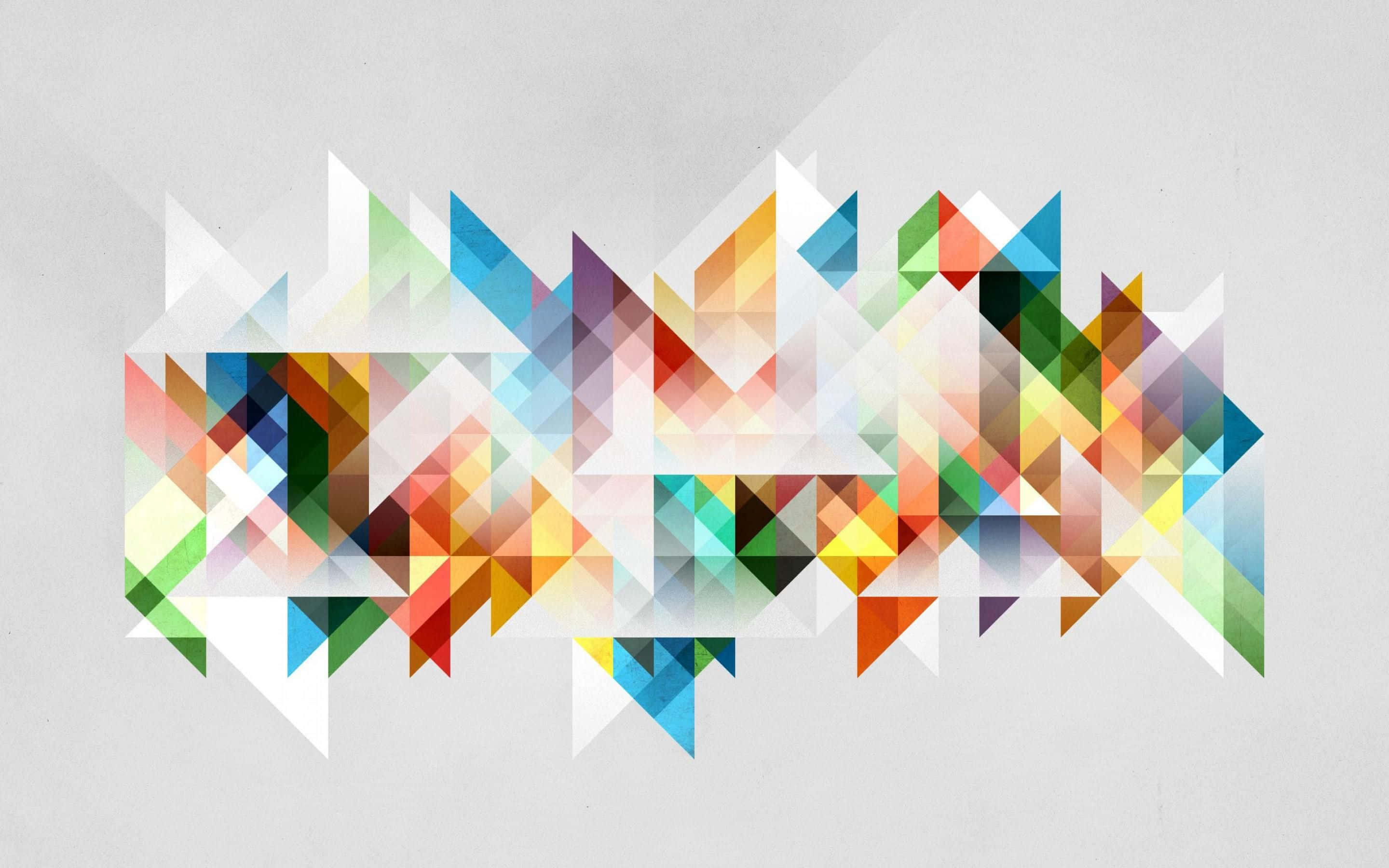 Geometric Desktop 桌布 壁紙 — 充滿活力的幾何三角形以彩虹色調在柔和的灰色背景上形成動態的抽象圖案。
