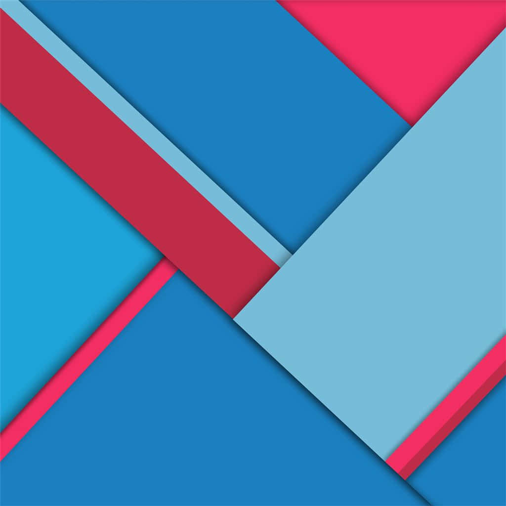 Material Design 桌布 壁紙 — 充滿活力的幾何圖案壁紙，大膽的藍色和粉紅色角形狀營造出動感的現代抽象構圖。