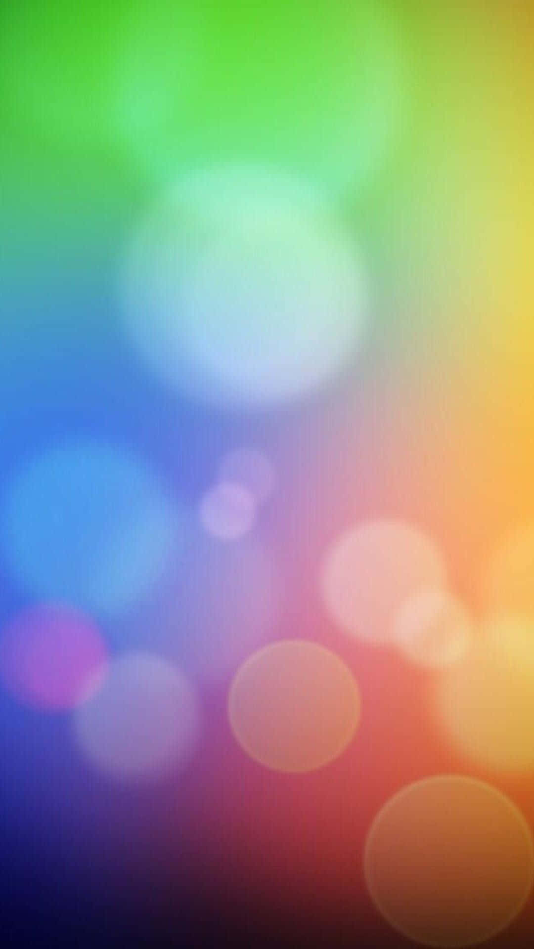 抽象 桌布 壁紙 — 充滿活力的彩虹散景燈光在漸變背景上柔和地模糊，營造出夢幻般的抽象光芒。