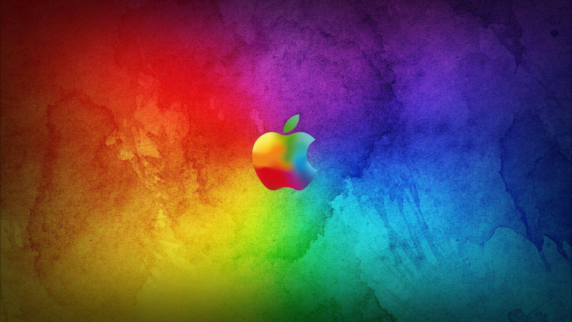 蘋果 桌布 壁紙 — 充滿活力的彩虹水彩潑濺在構圖中央的彩色Apple標誌後方放射開來。