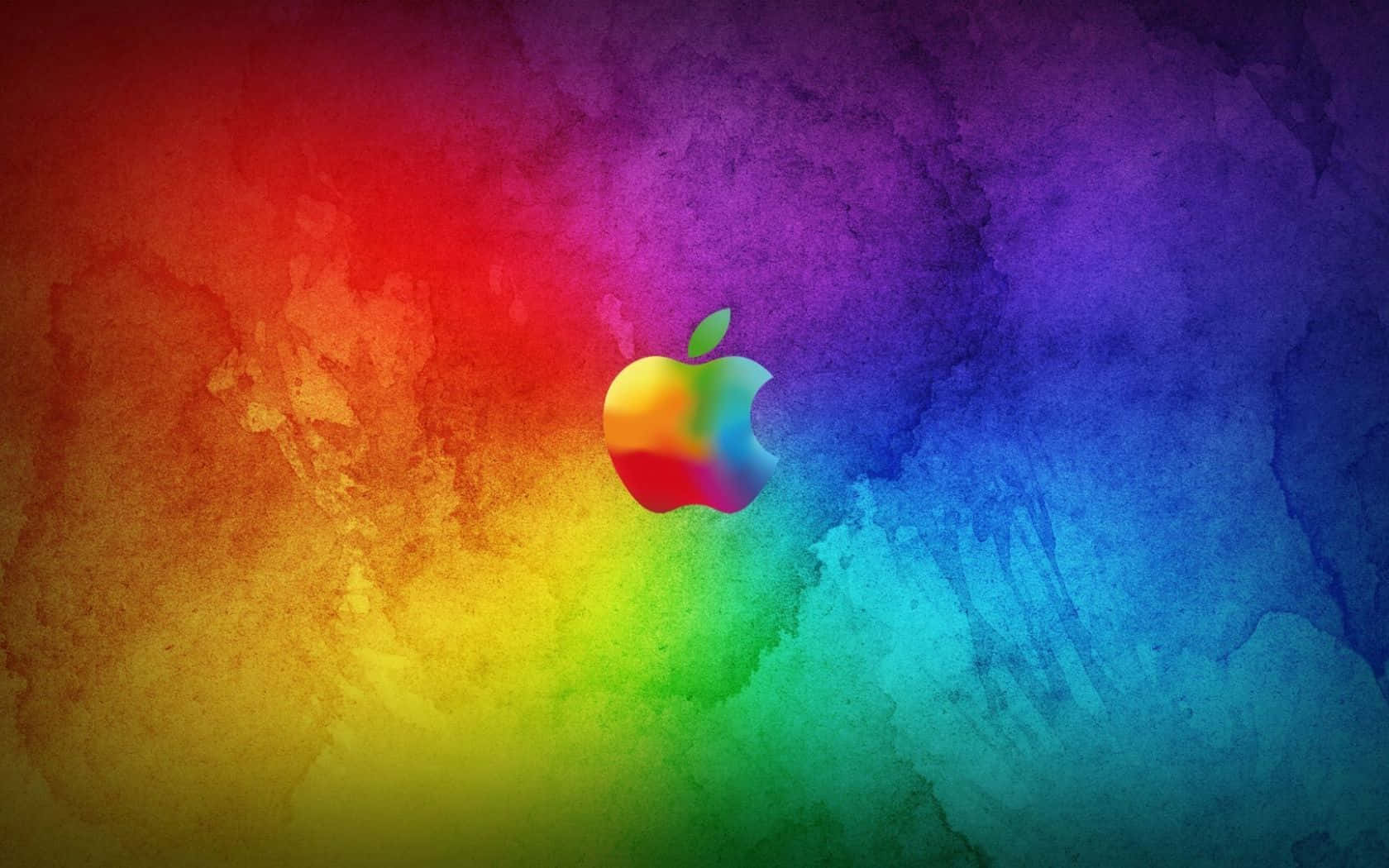 Colorful Aesthetic 桌布 壁紙 — 充滿活力的彩虹水彩潑濺在構圖中央的彩色Apple標誌後方綻放。