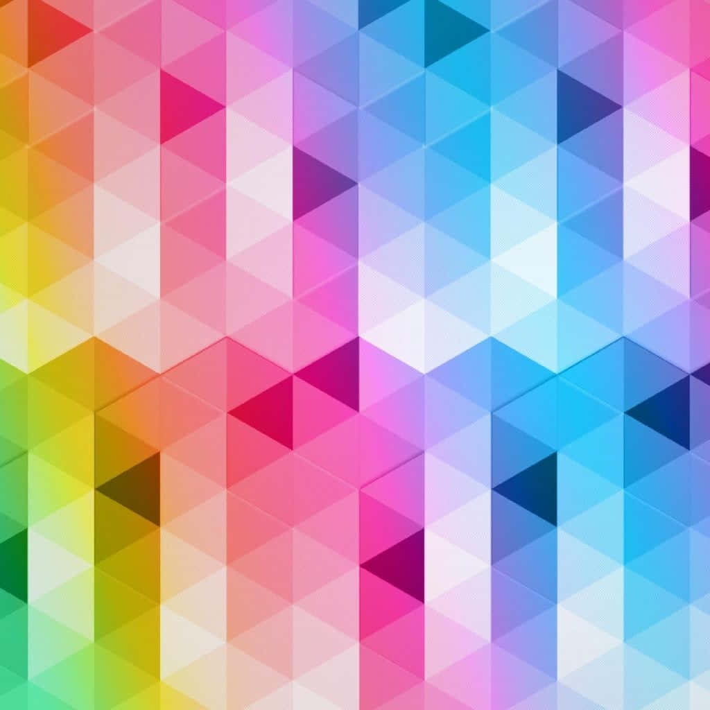 Multicolor 桌布 壁紙 — 充滿活力的彩虹漸變交錯三角形，創造出動態的幾何圖案。