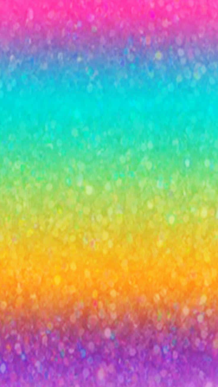 Rainbow Glitter 桌布 壁紙 — 充滿活力的彩虹漸變壁紙，閃爍的閃光粒子在表面閃耀。