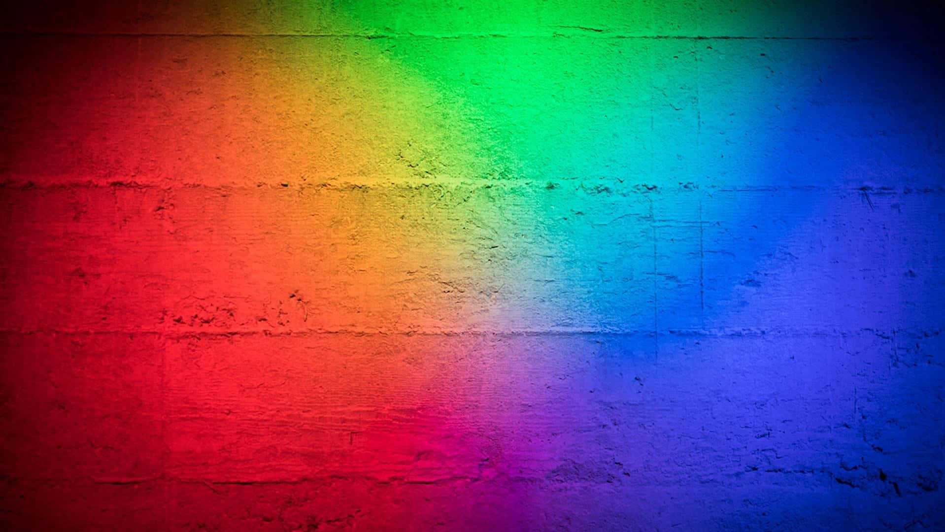 Neon Colors 桌布 壁紙 — 充滿活力的彩虹漸變柔和地融合在紋理混凝土牆面上。
