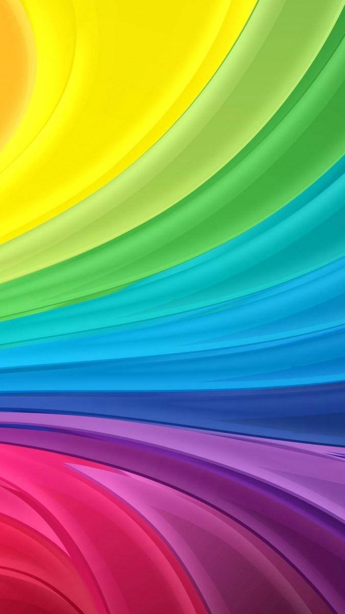 Rainbow iPhone 桌布 壁紙 — 充滿活力的彩虹色流動波浪以平滑漸變對角線掃過畫面。